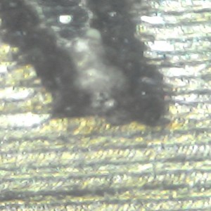 Фото микроскопом - верхний завиток буквы G